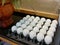 Dozen of duck egg for cooking breakfast in the restaurant kitchen, white ester egg, with blue background