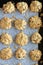 A dozen homemade maple Vermont cookies on parchment paper, fresh out of the oven