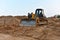 Dozer on earthmoving at construction site. Bulldozer on road work. Construction machinery and equipment on groundwork