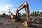 Dozer at open pit mining on sunseet background. Bulldozer for land clearing, grading, pool excavation, utility trenching and