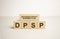 DPSP - Deferred Profit Sharing Plan acronym with wooden blocks, business concept background