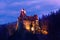 Dracula Castle with lights at night in Romania