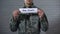 The draft written on sign in soldier hands, compulsory military service, duty