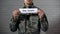 The draft written on sign in soldier hands, compulsory military service, duty