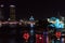 Dragon carp fountain and the Han River bridge in Da Nang at night