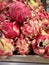 Dragon fruit or pitaya pieces set on a market