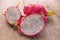 Dragon Fruit and some slice on old Wooden Table