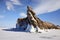 Dragon Rock on Ogoy Island. A cape popular with tourists, covered with icicles.