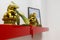 Dragon statue, Buddha statue and lucky charm on a shelf