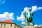 Dragon statue from Ljubljana, Captial city of Slovenia in eastern Europe. Nice blue sky with white clouds, red roofs background.
