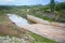 Drain canal behind the dam drains excess water from the lake - Drainage canal reservoir