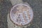Drain cap art on the surface of sewer cover on the walk way Shirakawa-go
