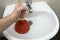 Drain Problems, blockage plumbing sink unclog plunger force cup male man hand