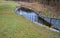 Drainage of drainage water from the bottom of the dam dam or pond through the upper safety overflow water overflow determines the