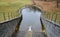 Drainage of drainage water from the bottom of the dam dam or pond through the upper safety overflow water overflow determines the