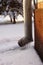 Drainpipe on the corner covered with ice and icicles