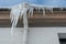 The drainpipes are covered with ice and snow. After a heavy snowstorm, the city is covered with snow and ice. There are many