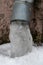 The drainpipes are covered with ice and snow. After a heavy snowstorm, the city is covered with snow and ice. There are many