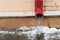 The drainpipes are covered with ice and snow. After a heavy snowstorm, the city is covered with snow and ice. There are many