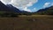 Dramatic Aerial Moving Quickly Over Flat Plains Toward Steep Mountains