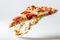 Dramatic angle of a floating pizza slice with cheese stretch and vibrant pepperoni toppings