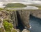 Dramatic atlantic rocky coastline cliffs landscape in Vagar. Faroe