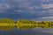 Dramatic autumn cloudy morning on a quiet lake