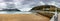 Dramatic autumn panoramic view of La Concha sand beach and Island de Santa Clara in the bay at old town center of San Sebastian,