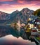 Dramatic autumn sunset on Hallstatt lake. Fantastic evening view of Hallstatt village, in Austria`s mountainous Salzkammergut