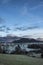 Dramatic beautiful Winter landscape image looking across countryside in Lake District with hard frost on the ground and crisp blue