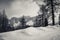 Dramatic black and white foggy snowcapped peaks mountain range in dolomites in wintertime, giau pass, italy