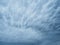 Dramatic blue sky with clouds. Spooky abstract background pattern texture.