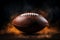 Dramatic close up of an American football ball surrounded by smoke