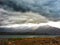 Dramatic clouds above lake near Mendoza in Argentinian Andes
