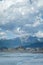 Dramatic clouds and distant mountains tower over the city of Viareggio, Italy