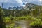 Dramatic clouds over Fern lake with Gabletop, Knobtop and Notchtop mountain peaks in colorado rockies