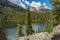 Dramatic clouds over Fern lake with Stones Peak mountain in Colo