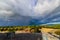 Dramatic clouds over the landscape of croatia with rain in the distance