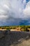 Dramatic clouds over the landscape of croatia with rain in the distance