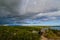 Dramatic clouds over the landscape of croatia with rain in the distance