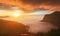 Dramatic Clouds rolling over mountains at sunset