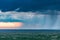 Dramatic clouds sun rays light burst on the savannah grasslands at the Maasai Mara National Game Reserve Park And Conservation Are