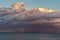 Dramatic clouds in a sunset light and rainbow over the mediterranean sea, Costa Brava in Spain