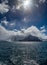 Dramatic clouds surround the sharp peaks of Antarctic mountains