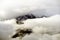 Dramatic clouds surrounding peak Ziel near Merano, Italy.