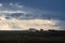 Dramatic cloudy stormy sky over two houses seaside