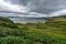 Dramatic coastal landscape in Scotland between the towns of Durness and Thurso under cloudy skies