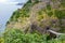 Dramatic coastal scenery old coastal road madeira with waterfall steep cliffs