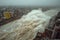 Dramatic Coastal Storm Surge with Massive Waves Crashing Over Buildings in Urban Area