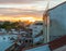 Dramatic color sunset rooftops of Madrid. Glowing fiery orange Madrid sky & rooftops at sunset.